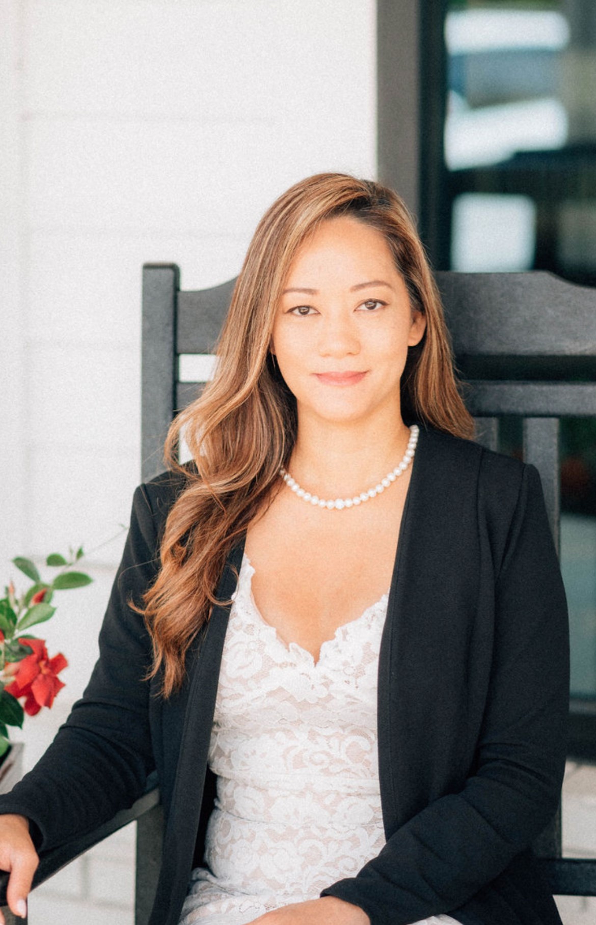 Professional woman with long hair in a blazer and lace top. Professional woman with long hair in a blazer and lace top.